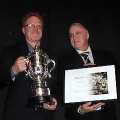 Peter de Lange holds the Loder Cup while Dr Rick McGovern-Wilson holds the associated plaque. The Beehive, Parliament Buildings, Wellington